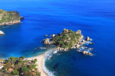 aerial photography of green island surrounded by blue sea thumbnail
