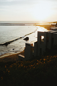 gray concrete house on seashore thumbnail