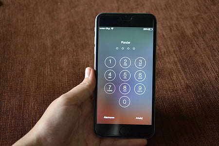 person holding space gray iPhone 6 thumbnail