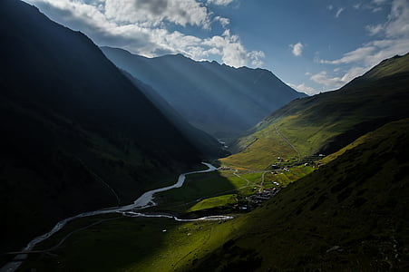 landscape photography of valley beside the mountains thumbnail