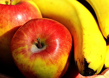 red apple beside riped banana thumbnail