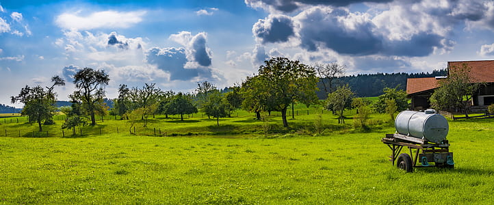 photo of gray steel tank on green grass thumbnail