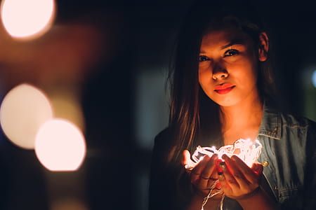 woman holding LED lights thumbnail