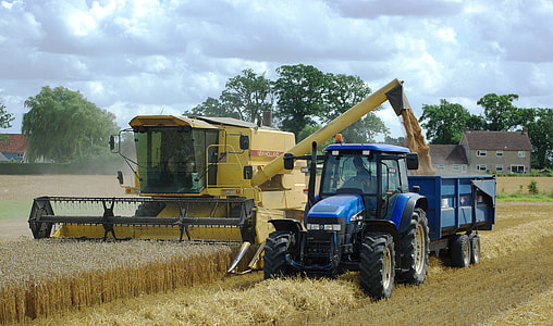 Tractors working in the grain field thumbnail