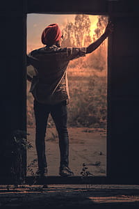 Man In White Button-up Shirt And Red Turban thumbnail