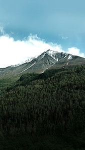 landscape photography of mountain peak under blue sky thumbnail
