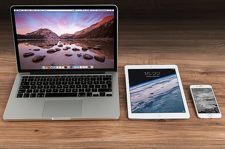 MacBook Pro. white iPad, and gold iPhone 6 thumbnail