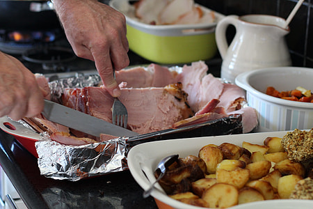 person slicing cooked meat thumbnail