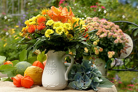 orange lilies and yellow mums centerpiece thumbnail