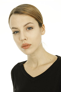 woman wearing black V-neck top thumbnail