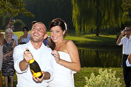 man opening wine bottle with woman thumbnail