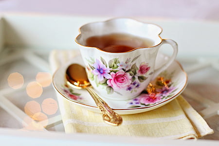 white and pink floral ceramic teacup and saucer thumbnail