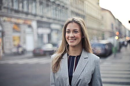 Young White Middle Aged Woman In Formal Blazer Walking on the street with open hair thumbnail