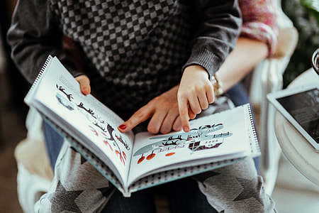 Child reading a book thumbnail