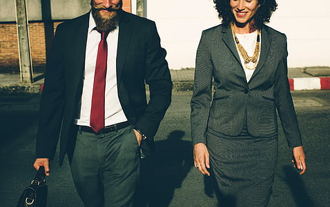 man and woman walking outside thumbnail