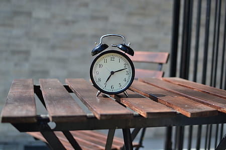 selective focus photography of twin bell clock thumbnail