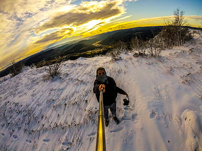 Man Standing on Snowy Terrain thumbnail