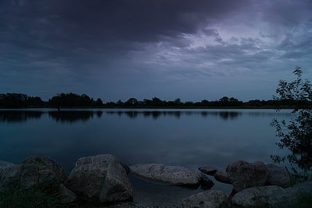 gray rocks beside body of water thumbnail