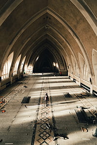 person wearing backpack walking inside building thumbnail