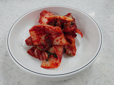 red dish in round white bowl thumbnail