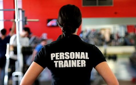 focus photo of woman wearing Personal Trainer shirt thumbnail