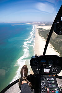 person inside helicopter while on flight thumbnail