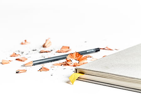 photo of black pencil beside book thumbnail