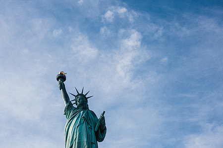 statue of liberty under blue sky during day time thumbnail