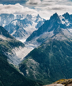 aerial view of mountain under clouds thumbnail