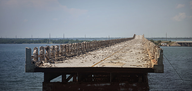 unfinished gray concrete bridge during daytime thumbnail