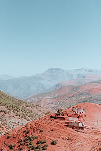 concrete houses on brown mountain thumbnail