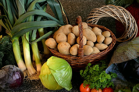 basket of potatoes beside cabbage thumbnail