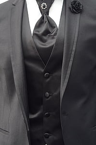 person wearing black notched lapel suit jacket thumbnail