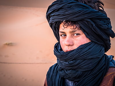 man wearing blue headscarf thumbnail