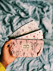 person holding pouches thumbnail
