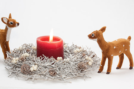 two deer plush toy and red pillar candle thumbnail