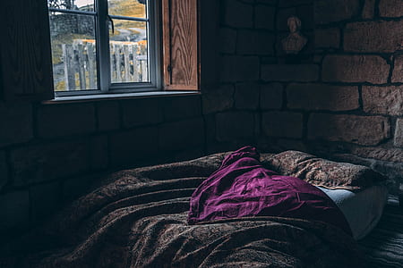 brown blanket near window thumbnail