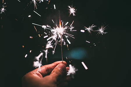 closeup photo of person holding sparkler thumbnail