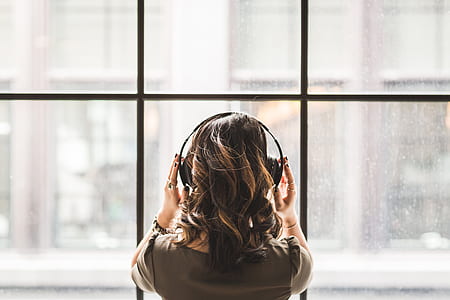 woman in the window while listening music thumbnail