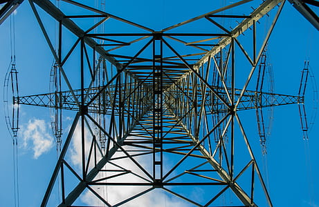 worms eye view of electric post during daytime thumbnail
