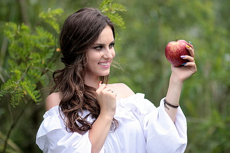 woman holding apple fruit thumbnail