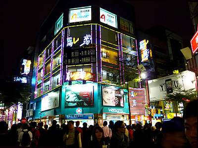people near building during nighttime thumbnail