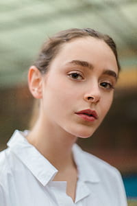woman wearing white collared top thumbnail