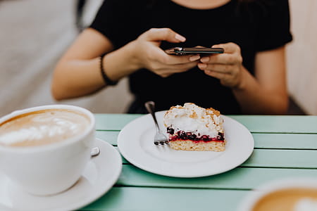 Drinking coffee and eating cake in a cafeteria thumbnail