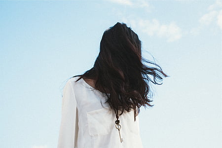 woman standing while face covered by hair thumbnail