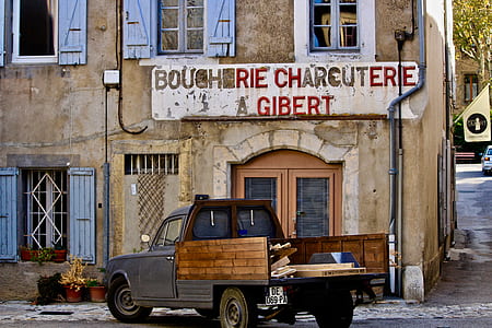 grey and brown pickup truck beside Bougherie Charcuterie building thumbnail