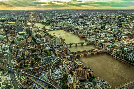 aerial view of buildings and body of water thumbnail
