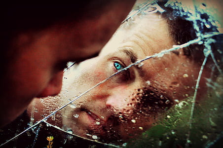 Blue Eyed Man Staring at the Mirror thumbnail
