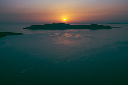 silhouette photography of island thumbnail