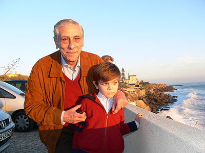 photography of man holding boys shoulders thumbnail